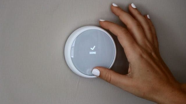 Nest E Thermostat installed on the wall. Nest E Thermostat installed on the wall.