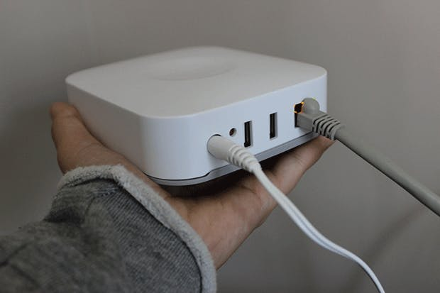 Man holding the Samsung Connect Home Router. Man holding the Samsung Connect Home Router.
