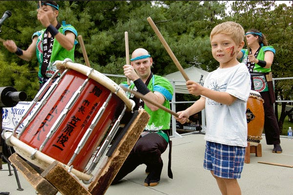 Little boy playing drum with other drummers. Little boy playing drum with other drummers.