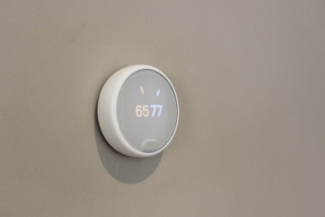 Nest E Thermostat installed on the wall. Nest E Thermostat installed on the wall.