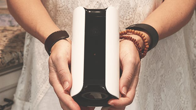 A girl holding the Canary All-in-One A girl holding the Canary All-in-One